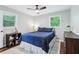 Cozy bedroom with ceiling fan, drawers, and windows for ample natural light at 3036 Horse Shoe Se Dr, Atlanta, GA 30316