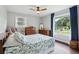 Comfortable bedroom features a ceiling fan, windows offering natural light, and tasteful decor at 3036 Horse Shoe Se Dr, Atlanta, GA 30316