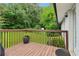 Relaxing outdoor deck featuring wood railings, and lovely green surroundings at 3036 Horse Shoe Se Dr, Atlanta, GA 30316
