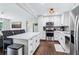 Bright kitchen features stainless steel appliances, marble countertop island, and white cabinetry at 3036 Horse Shoe Se Dr, Atlanta, GA 30316