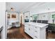Bright kitchen features stainless steel appliances, marble countertop island, and hardwood floors at 3036 Horse Shoe Se Dr, Atlanta, GA 30316