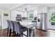 Modern kitchen with island seating, stainless steel appliances, and ample cabinet space at 3036 Horse Shoe Se Dr, Atlanta, GA 30316