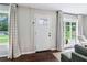 Bright living room with large windows and hardwood floors has a cozy, inviting atmosphere at 3036 Horse Shoe Se Dr, Atlanta, GA 30316