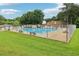 This neighborhood boasts a sparkling pool surrounded by a secure fence, benches, and lush grass at 3036 Horse Shoe Se Dr, Atlanta, GA 30316