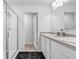 Bright bathroom featuring a tiled shower, and double vanity with ample countertop space at 5668 Union Pointe Dr, Union City, GA 30291