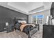 Comfortable bedroom with tray ceiling and modern decor, with natural light at 5668 Union Pointe Dr, Union City, GA 30291