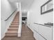 Inviting entryway features a staircase and modern storage creating a functional and stylish space at 5668 Union Pointe Dr, Union City, GA 30291