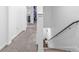 Hallway featuring neutral carpet with stairs to the side at 5668 Union Pointe Dr, Union City, GA 30291