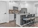 Well-equipped kitchen with stainless steel appliances, granite countertops, and a functional island with seating at 5668 Union Pointe Dr, Union City, GA 30291