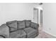 Comfortable living room featuring a gray sofa and neutral carpeting at 5668 Union Pointe Dr, Union City, GA 30291