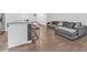 Open-concept living space with modern kitchen, spacious living area, and hardwood floors for seamless living at 5668 Union Pointe Dr, Union City, GA 30291