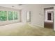 Spacious bedroom features a ceiling fan and a window with tree views at 10795 Glenbarr Dr, Johns Creek, GA 30097