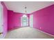 Bedroom featuring bright walls, carpet floors, and a window with a view of the street at 10795 Glenbarr Dr, Johns Creek, GA 30097