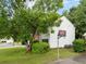 Two story house with attached basketball hoop and lush front yard at 10795 Glenbarr Dr, Johns Creek, GA 30097