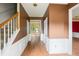 Foyer with neutral color palette, hard surface floors, and staircase to the upper level at 10795 Glenbarr Dr, Johns Creek, GA 30097