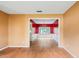 Open-concept living room with beautiful wood-look floors adjacent to the dining room at 10795 Glenbarr Dr, Johns Creek, GA 30097