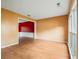 Bright living room with laminate flooring and neutral wall color across from the dining room at 10795 Glenbarr Dr, Johns Creek, GA 30097
