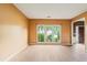 Spacious living room featuring large windows and wood-look flooring at 10795 Glenbarr Dr, Johns Creek, GA 30097