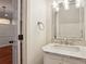 Well-lit bathroom vanity with framed mirror, marble countertop, and modern faucet at 1245 S Ponce De Leon Ne Ave # 13, Atlanta, GA 30306
