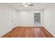 A bright bedroom offers hardwood floors, fresh paint, and a window with views of the green yard at 1245 S Ponce De Leon Ne Ave # 13, Atlanta, GA 30306
