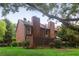 Brick home with fenced backyard, lush green grass, and privacy landscaping at 1245 S Ponce De Leon Ne Ave # 13, Atlanta, GA 30306