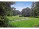 Lush green common area with a winding sidewalk and park benches for residents at 1245 S Ponce De Leon Ne Ave # 13, Atlanta, GA 30306