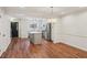 Open floorplan with kitchen island, stainless steel appliances, and hardwood flooring at 1245 S Ponce De Leon Ne Ave # 13, Atlanta, GA 30306