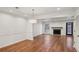 Open-concept living room showcases fireplace, wood flooring, and neutral decor at 1245 S Ponce De Leon Ne Ave # 13, Atlanta, GA 30306