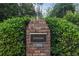 Brick monument with address and 'Devonshire' sign surrounded by manicured bushes at 1245 S Ponce De Leon Ne Ave # 13, Atlanta, GA 30306