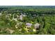 Wide aerial view of houses in a community surrounded by a dense forest at 3639 Paper Mill Se Rd, Marietta, GA 30067