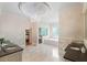 Luxury bathroom with double sinks, tile floors, and a chandelier at 3639 Paper Mill Se Rd, Marietta, GA 30067