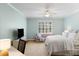 Bright bedroom with sitting area, ceiling fan and a large bed at 3639 Paper Mill Se Rd, Marietta, GA 30067