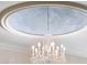 Decorative ceiling with an elegant crystal chandelier adds a touch of luxury at 3639 Paper Mill Se Rd, Marietta, GA 30067