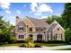 Beautiful home with stone, shingle, and brick facade, landscaped yard, and inviting front porch at 3639 Paper Mill Se Rd, Marietta, GA 30067