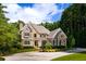 Beautiful home with stone and shingle accents, a welcoming front porch, and a well-manicured lawn at 3639 Paper Mill Se Rd, Marietta, GA 30067