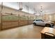 Spacious three-car garage with ample storage and an elegant lighting fixture at 3639 Paper Mill Se Rd, Marietta, GA 30067