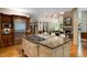 Well-equipped kitchen with stainless steel appliances, large island, and custom wood cabinetry at 3639 Paper Mill Se Rd, Marietta, GA 30067