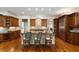 Stylish kitchen island with bar stool seating, custom cabinets, and modern appliances at 3639 Paper Mill Se Rd, Marietta, GA 30067