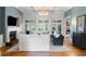Elegant living room featuring a fireplace, stylish decor, and French doors leading to the outdoor patio at 3639 Paper Mill Se Rd, Marietta, GA 30067