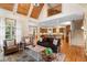 Open-concept living room with vaulted wood ceiling, staircase, and views into the kitchen at 3639 Paper Mill Se Rd, Marietta, GA 30067