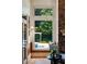 Bright living room featuring a large window with views of the outdoor pool and lush landscaping at 3639 Paper Mill Se Rd, Marietta, GA 30067