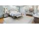 Spacious main bedroom with tray ceilings, a sitting area, and plush carpeting at 3639 Paper Mill Se Rd, Marietta, GA 30067