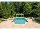 Stunning pool area with lush landscaping and elegant lounge chairs for relaxing at 3639 Paper Mill Se Rd, Marietta, GA 30067