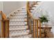 Elegant staircase with carpet runner and wood railing, adding a touch of sophistication at 3639 Paper Mill Se Rd, Marietta, GA 30067