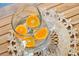 Refreshing view of a clear pitcher of water with orange slices and accompanying drinking glasses at 3639 Paper Mill Se Rd, Marietta, GA 30067