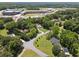 Desirable neighborhood featuring a home with a lush, green lawn, mature trees, and nearby school and stadium at 3729 Meadow Glen Cir, Ellenwood, GA 30294
