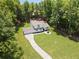 A bright and well-maintained home sits on a sprawling green lawn with mature trees at 3729 Meadow Glen Cir, Ellenwood, GA 30294