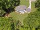 A well-maintained lawn stretches out behind this home, framed by mature trees offering privacy and shade at 3729 Meadow Glen Cir, Ellenwood, GA 30294