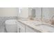 The bathroom has double sinks with granite countertops, white cabinets, and soaking tub at 3729 Meadow Glen Cir, Ellenwood, GA 30294