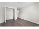 An empty bedroom showcases a closet and hardwood flooring at 3729 Meadow Glen Cir, Ellenwood, GA 30294